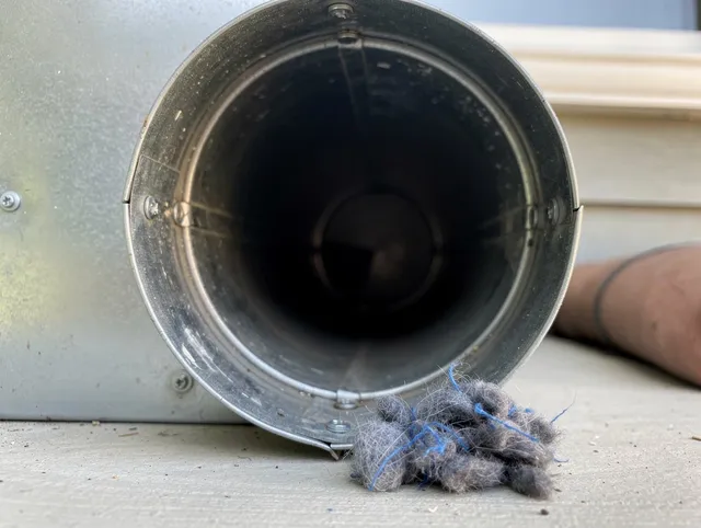 East Los Angeles Dryer Vent Cleaning technician using specialized equipment to clear severe dryer vent blockage in East Los Angeles